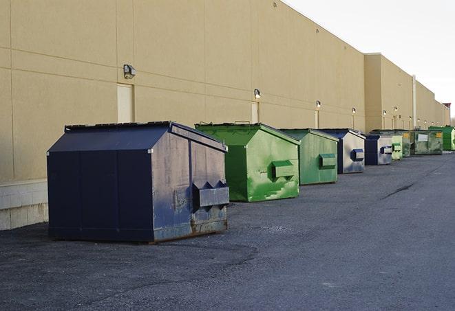 metal waste containers sit at a busy construction site in Cade LA